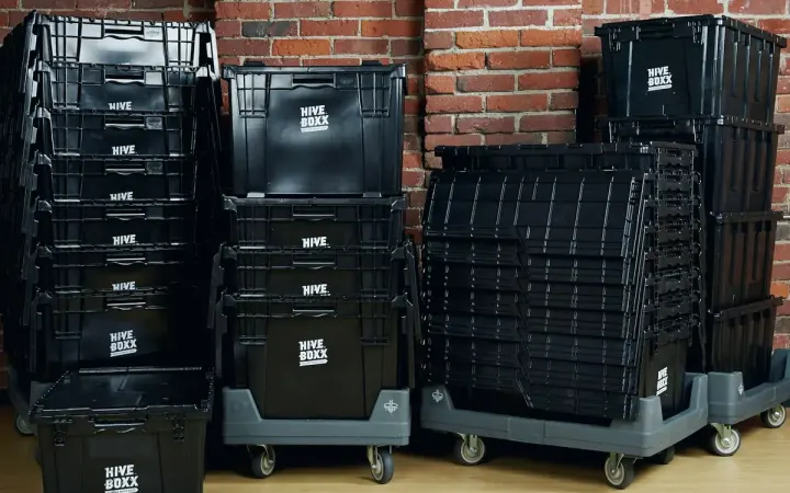 Plastic moving crates on trolleys